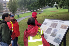 Chris meet with the Friends of Selly Oak Park, reading the notice board about the history of the Old Oak Tree